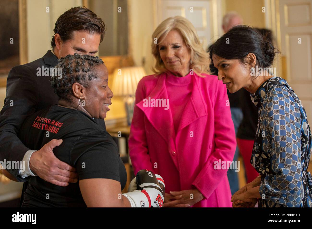 London, United Kingdom. 05th May, 2023. U.S first lady Jill Biden, center, Akshata Murty, right, wife of British Prime Minister Rishi Sunak, are introduced to veteran Maurillia Simpson, left, with Fighting Chance boxing charity by the UK Minister for Veterans Affairs Johnny Mercer, 2nd left, at 10 Downing Street, May 5, 2023 in London, United Kingdom. Credit: Erin Scott/White House Photo/Alamy Live News Stock Photo