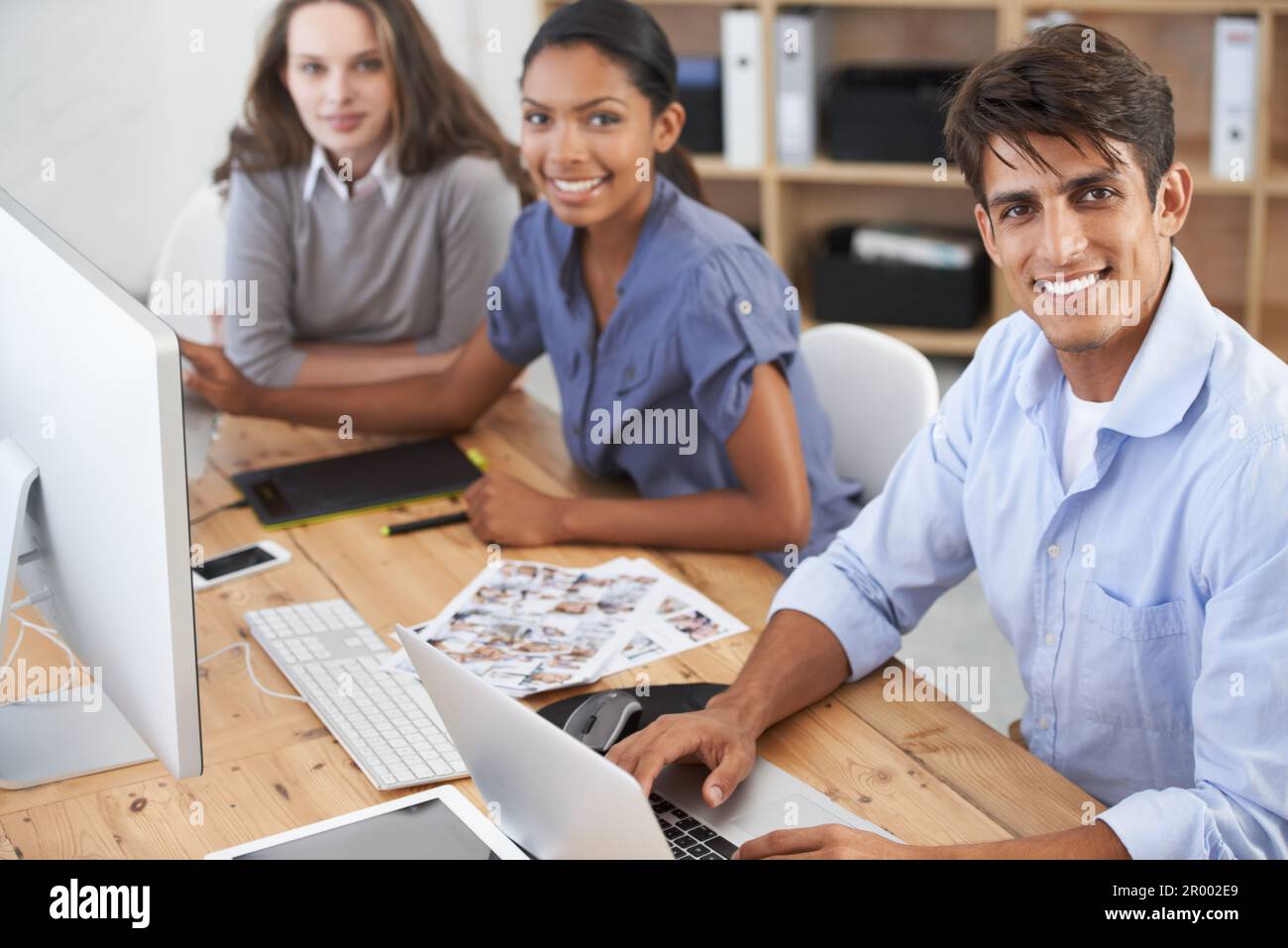 We come up with all the advertisements. three young colleagues working ...
