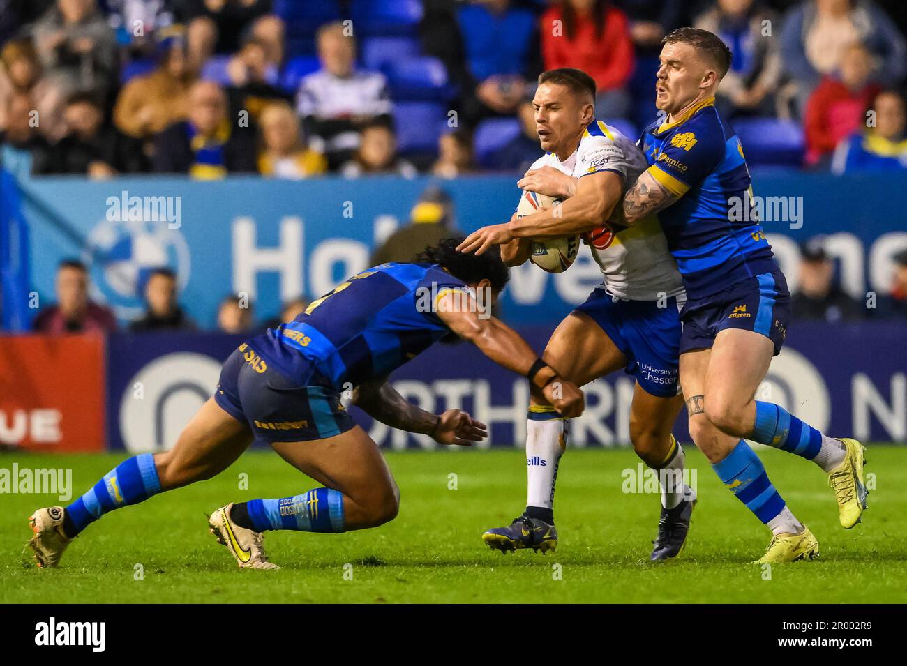 Wakefield Wolves Matty Russell #34 of Warrington Wolves is tackled by Jorge Taufua #2 ...