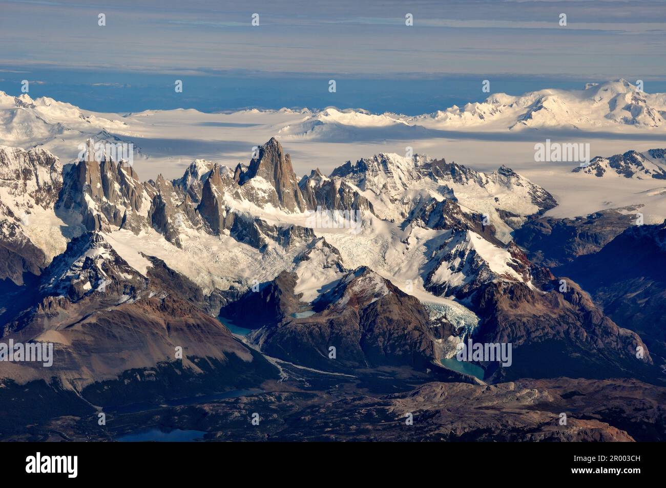 aerial view of mountains Cerro Torre (left), Fitz Roy (middle), volcano Lautaro (right) and the southern patagonian ice field, Patagonia, between Chil Stock Photo