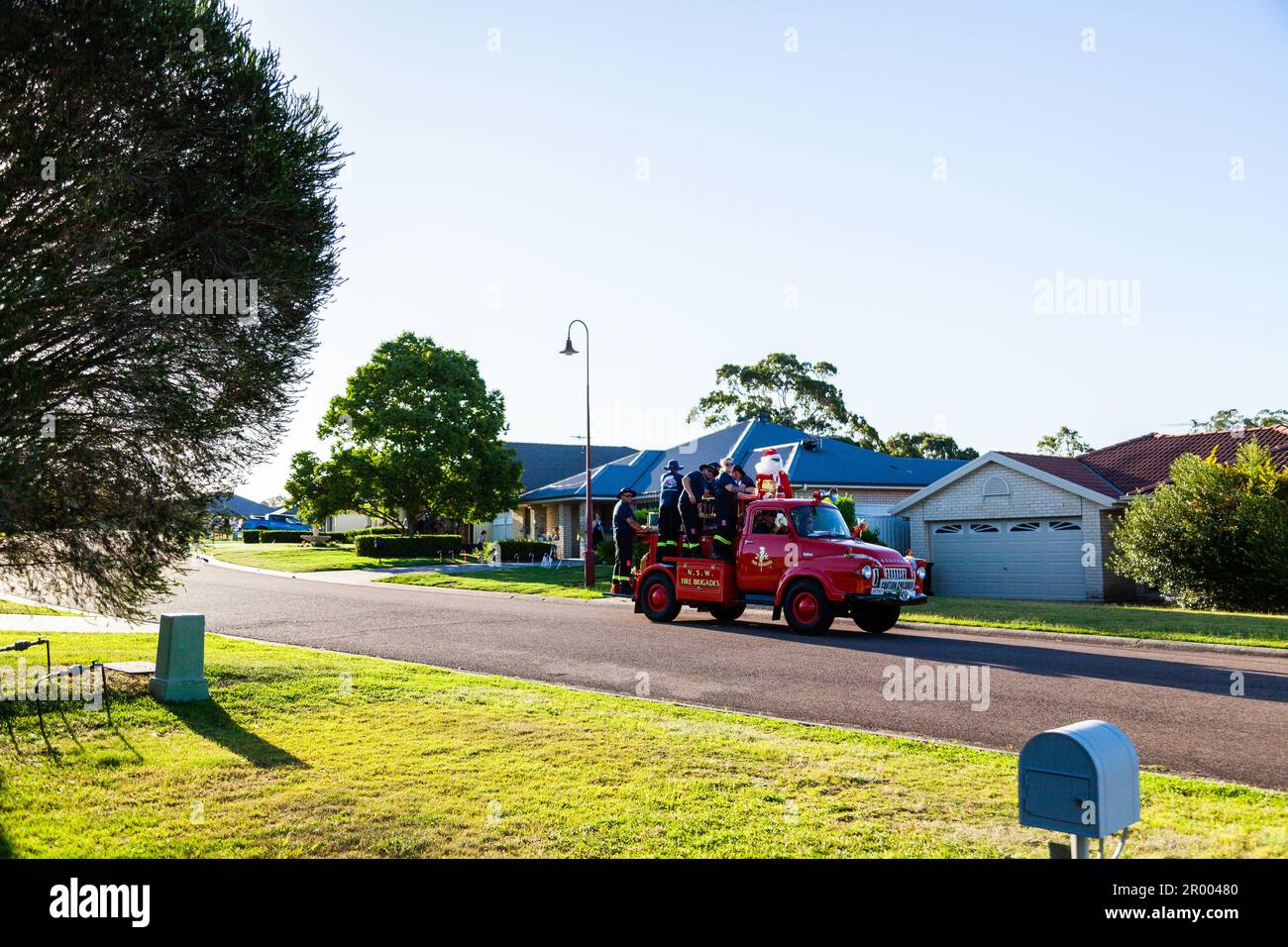 Christmas time lolly run fire truck escorting Santa Claus around the town of Singleton to give out lollies Stock Photo