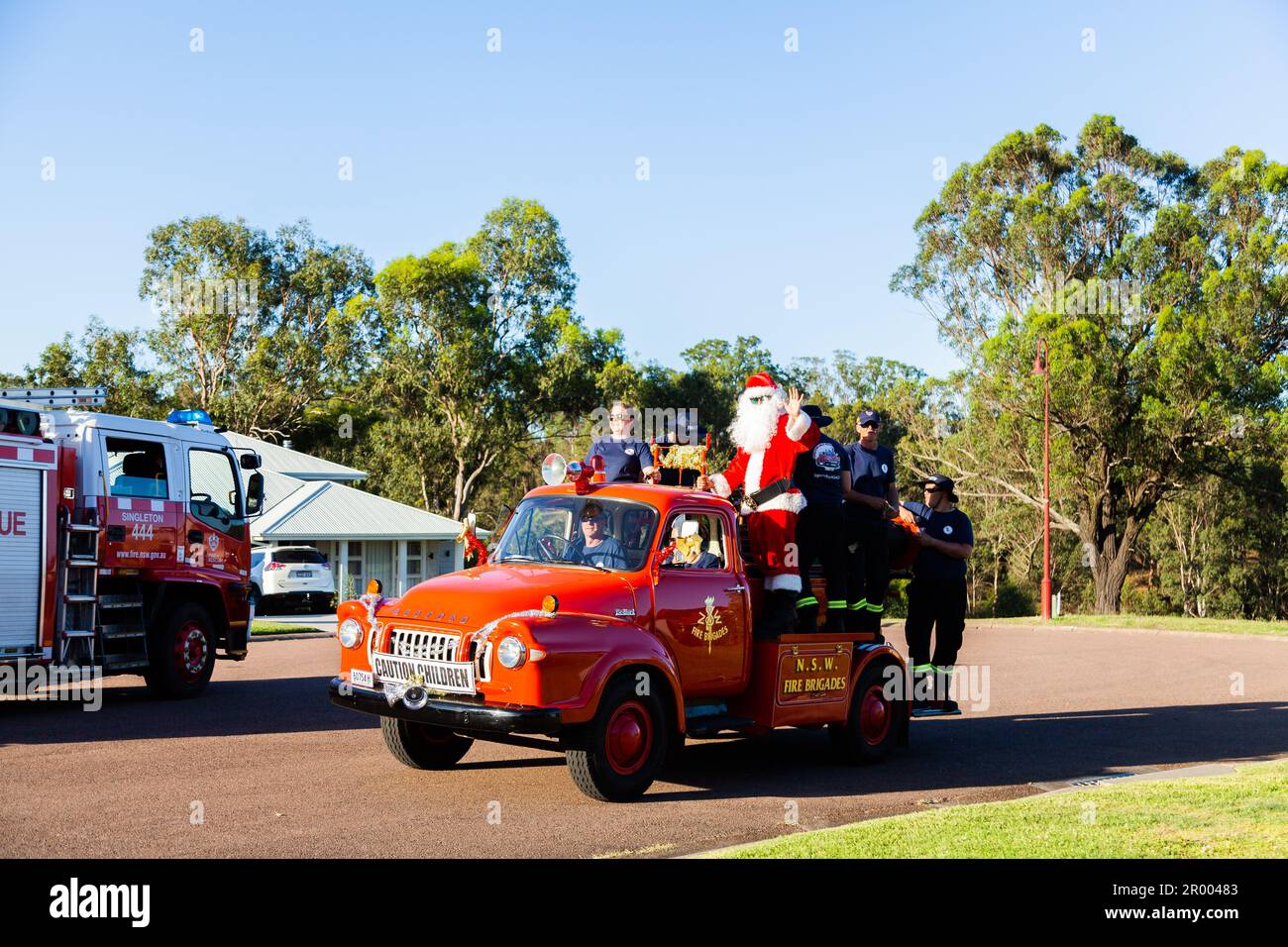 Christmas time lolly run fire truck escorting Santa Claus around the town of Singleton to give out lollies Stock Photo