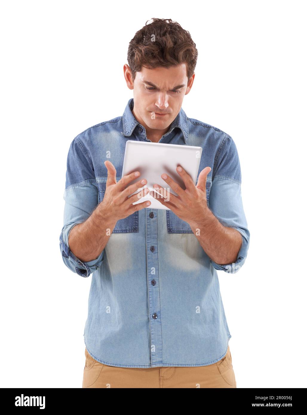 How did that happen. A casual young man holding his digital tablet ...