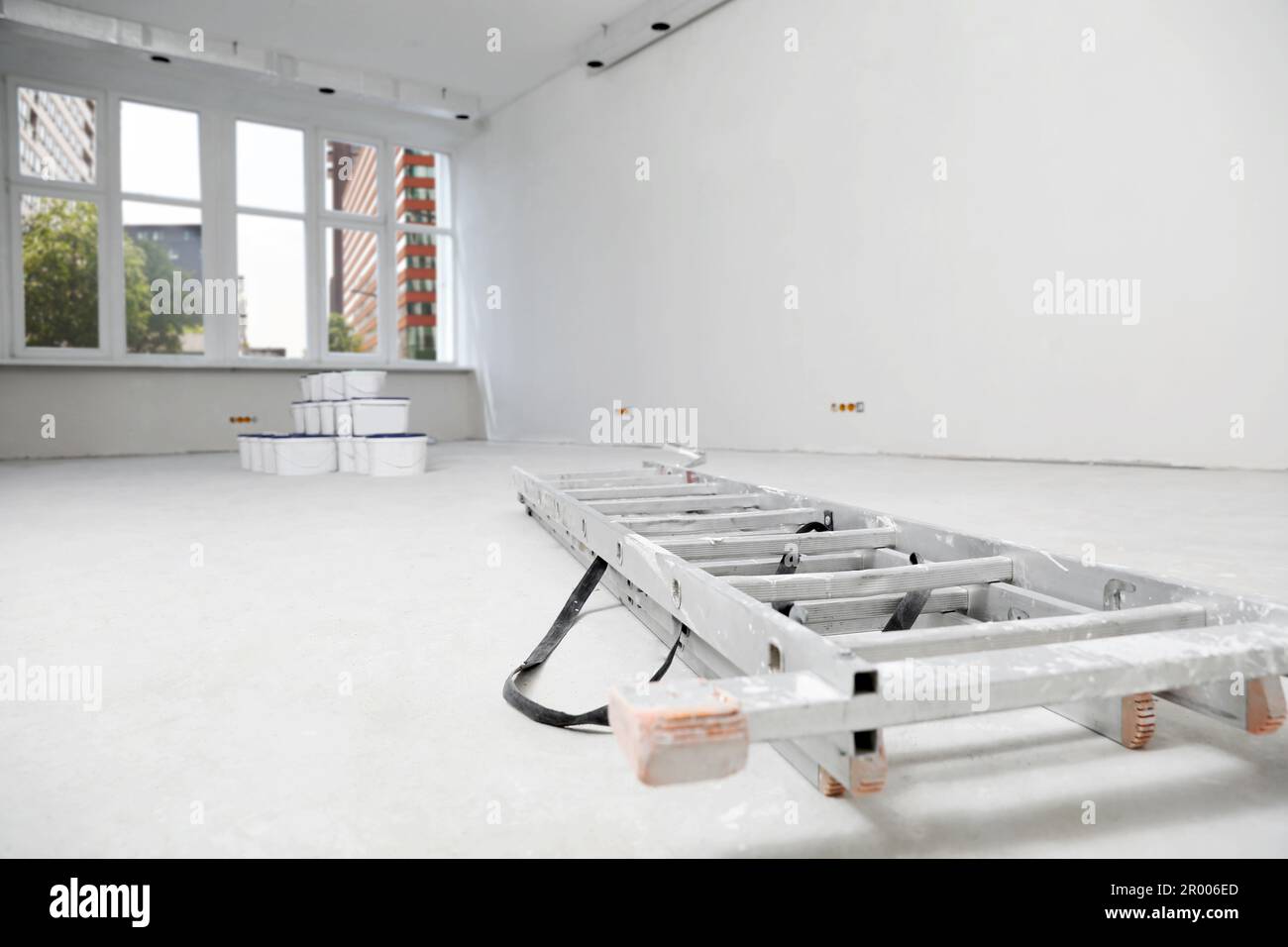 View of Materials in apartment during repair, focus on ladder. Home renovation ...