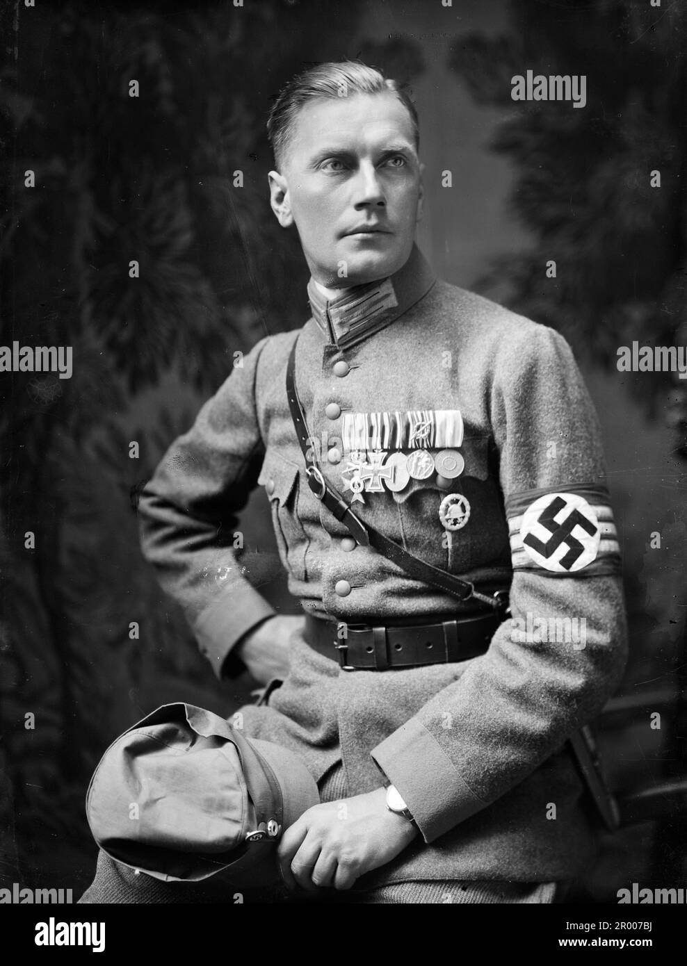 Wilhelm Brückner (11 December 1884 – 18 August 1954) was Adolf Hitler's chief adjutant until October 1940. Thereafter, Brückner joined the army, becoming an Oberst (colonel) by the end of World War II. In late 1922 he joined the Nazi Party . On 9 November 1923 Brückner took part in the Beer Hall Putsch in Munich, and was found guilty of aiding and abetting high treason. Brückner was appointed Chief Adjutant to Hitler on 20 February 1934, and retained that role until being dismissed on 18 October 1940. Here he is wearing his nazi uniform with nazi swastika armband, military decorations, shoulde Stock Photo