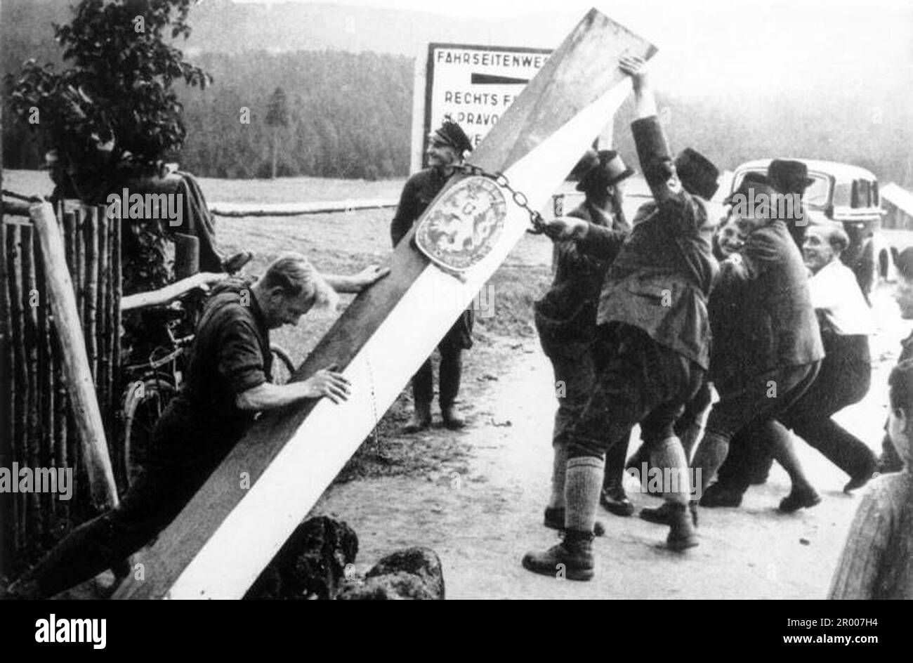 Henlein fascists (members of the Nazi party in the Sudetenland) remove the border posts on the German-Czechoslovak border in anticipation of the German invasion after the Munich agreement in September 1938. Bundesarchiv, Bild 183-58507-003 / CC-BY-SA 3.0 Stock Photo