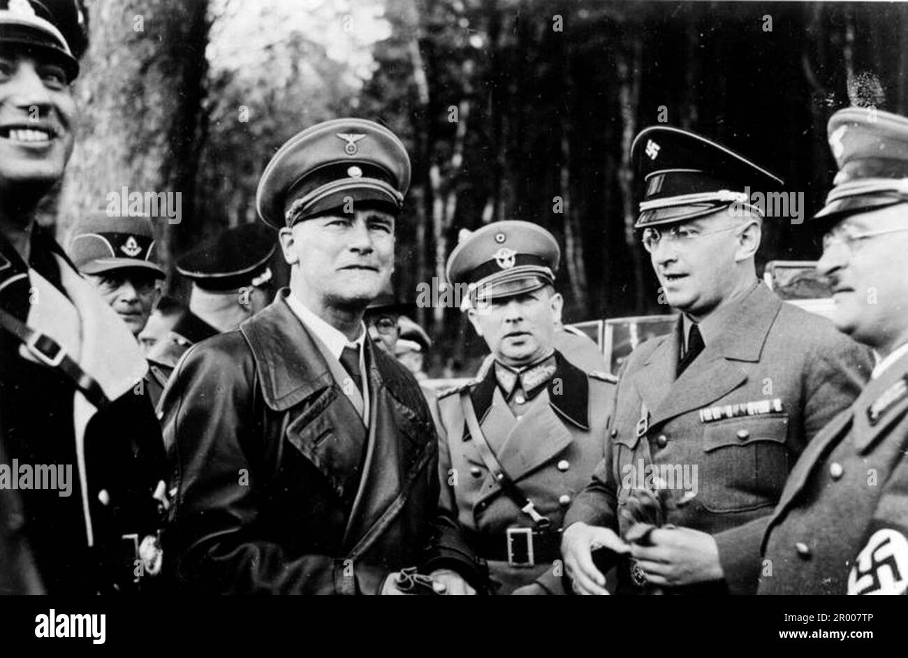 The nazi minister of the interior Wilhelm Frick with other prominent nazis during an official visit to Czechoslovakia after the annexation of the Sudetenland. After the annexation of Austria, Hitler demanded that he be given the Sudeten region of Czechoslovakia. At the Munich conference in September 1938 the Western powers agreed to this and the nazis occupied the area. Not long after Hitler broke his promise and invaded the rest of Czechoslovakia before turning his attention to Poland. From left Wilhelm Stuckart, Frick, Adolf von Bomhard (head of Order Police) Konrad Henlein (Sudeten German l Stock Photo