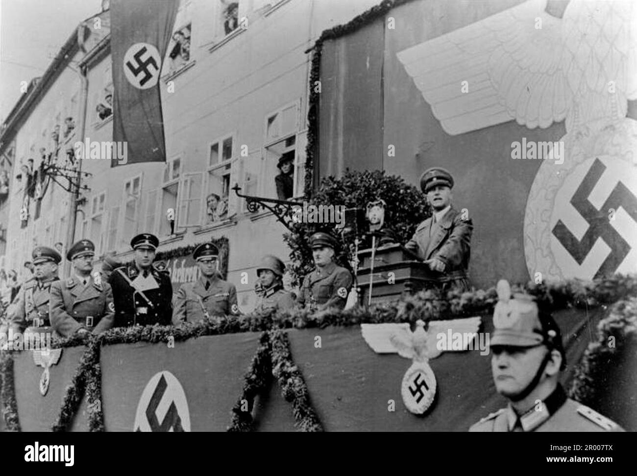 The nazi minister of the Interior Wilhelm Frick speaking during an official visit from a swastika bedecked platform in Czechoslovakia after the annexation of the Sudetenland. After the annexation of Austria, Hitler demanded that he be given the Sudeten region of Czechoslovakia. At the Munich conference in September 1938 the Western powers agreed to this and the nazis occupied the area. Not long after Hitler broke his promise and invaded the rest of Czechoslovakia before turning his attention to Poland. Bundesarchiv, Bild 121-0018 / CC-BY-SA 3.0 Stock Photo