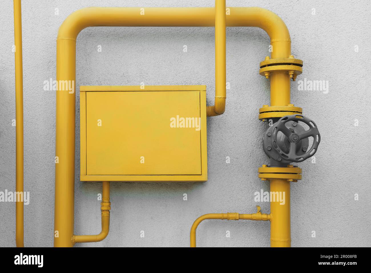 Gas meter box and pipes near grey wall outdoors Stock Photo Alamy