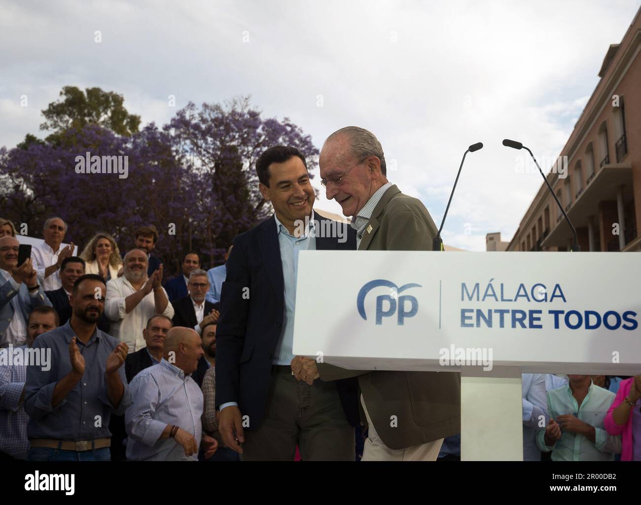 Andalusian regional president Juanma Moreno (L) is seen chatting with popular candidate for municipal elections and current Malaga mayor Francisco de la Torre (R), as they take part during an electoral pre-campaign event. The president of the Spanish Popular Party, Alberto Nunez Feijoo, has begun a tour of pre-election events in several cities across the country to support the Popular Party's candidates for the upcoming municipal elections. The results of the municipal elections on May 28th could influence the vote in the Spanish general elections at the end of the year. Stock Photo