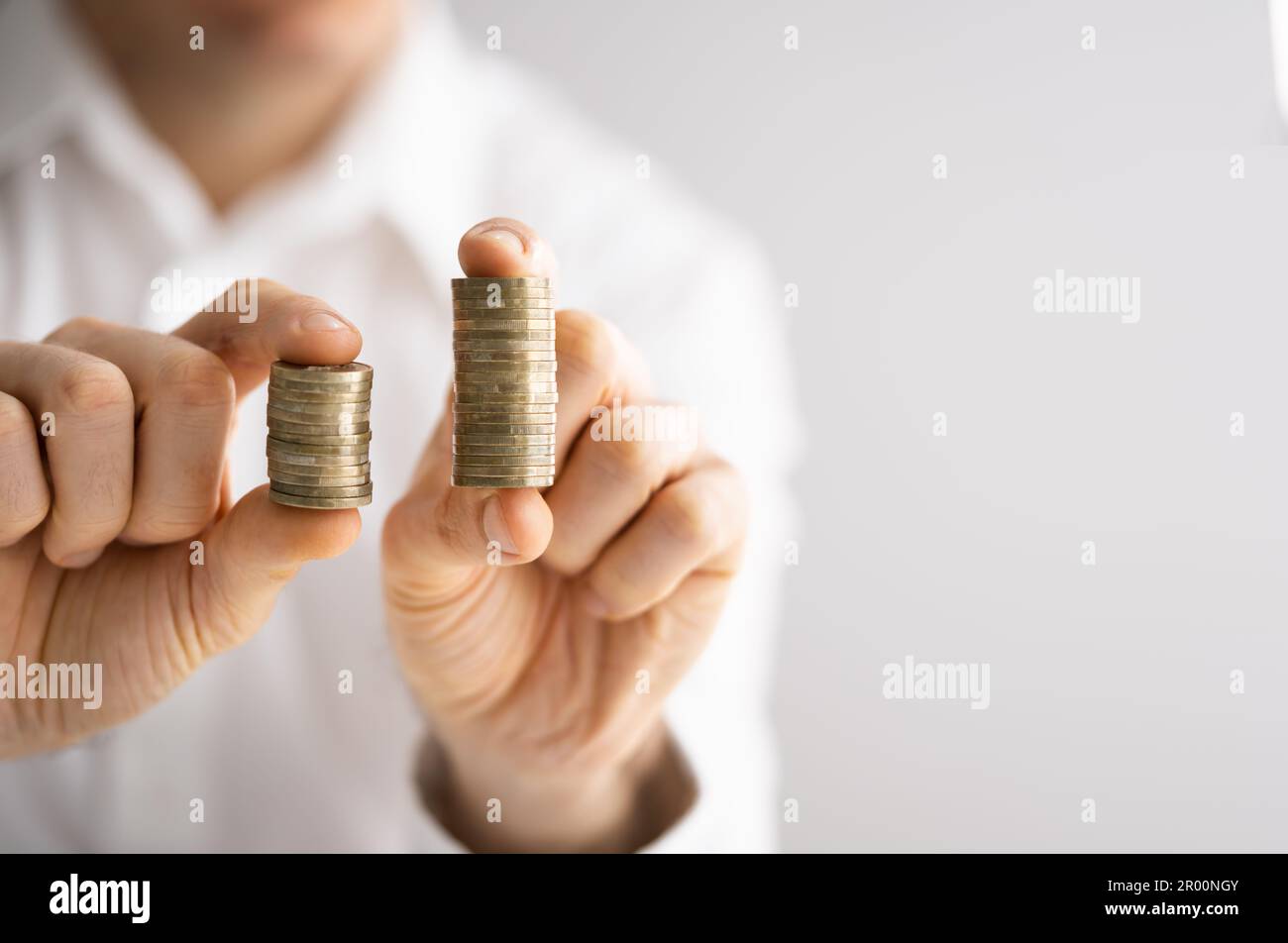 Compare Wage And Money Gap. Equal Pay Stock Photo