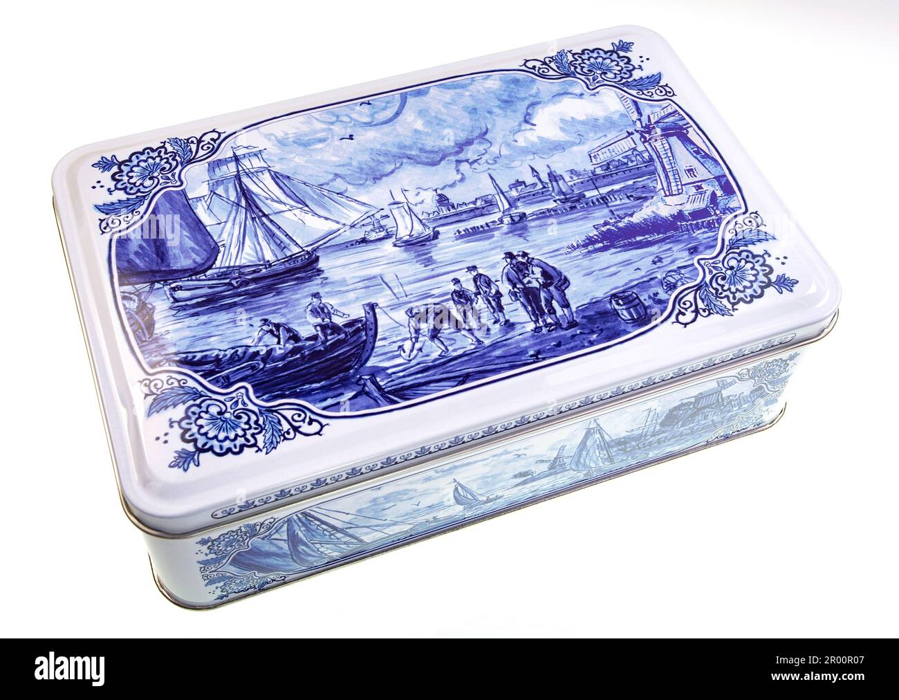 Vintage biscuit tin box with classical Dutch spiced cookies and decorated with a traditional boat and canal life scene for Hellema. Stock Photo