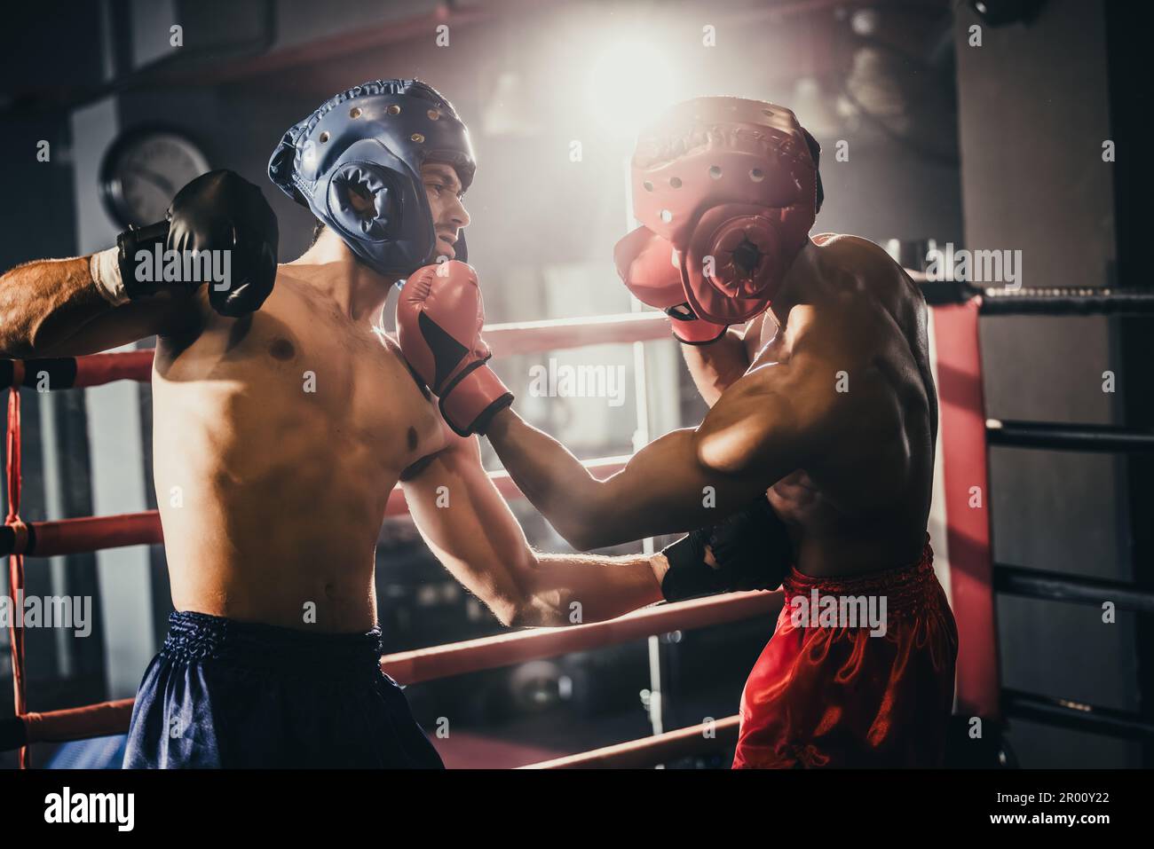 Boxer use various punch combinations, including the jab, hook, uppercut,  cross, swing, straight. Getting in close to make opponent on ropes and  knocko Stock Photo - Alamy