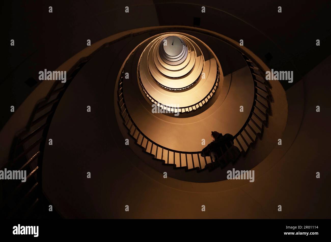 Spiral staircase in a tall multi-floor house, in the form of a 'golden ratio', architecture, concert Stock Photo