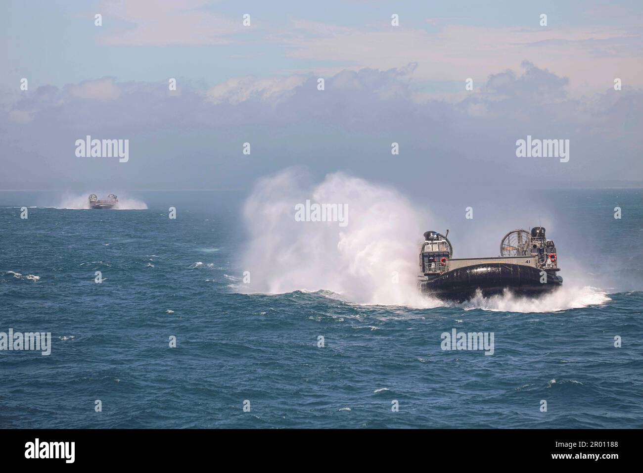 Atlantic Ocean. 30th Apr, 2023. Landing craft air cushions (LCAC), assigned to Attack Craft Unit 4, steams towards the amphibious dock landing ship USS Carter Hall (LSD 50) during LCAC operations in the Atlantic Ocean. Carter Hall, along with the amphibious transport dock ship USS Mesa Verde (LPD 19) and the amphibious assault ship USS Bataan (LHD 5), is participating in the Carrier Strike Group 4 Amphibious Ready Group, Marine Expeditionary Unit exercise (ARGMEUEX). ARGMEUEX is a maritime exercise that enhances the integration and collective capabilities of the Bataan Amphibious Ready Group Stock Photo