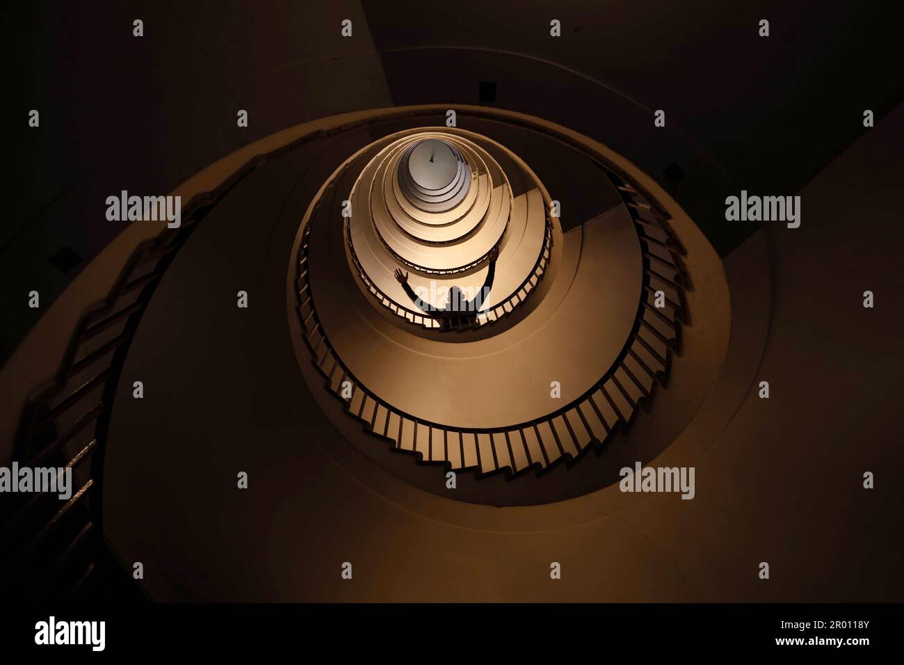 Spiral staircase in a tall multi-floor house, in the form of a 'golden ratio', architecture, concert Stock Photo