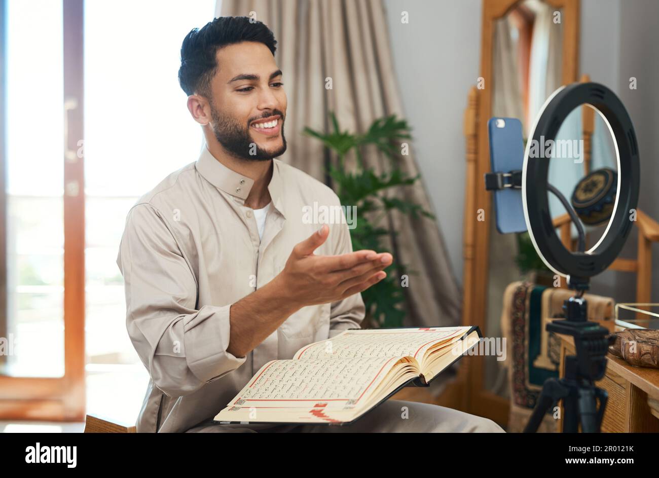 Dont vlog for views, vlog for your viewers. a young muslim man busy recording his for her vlog. Stock Photo