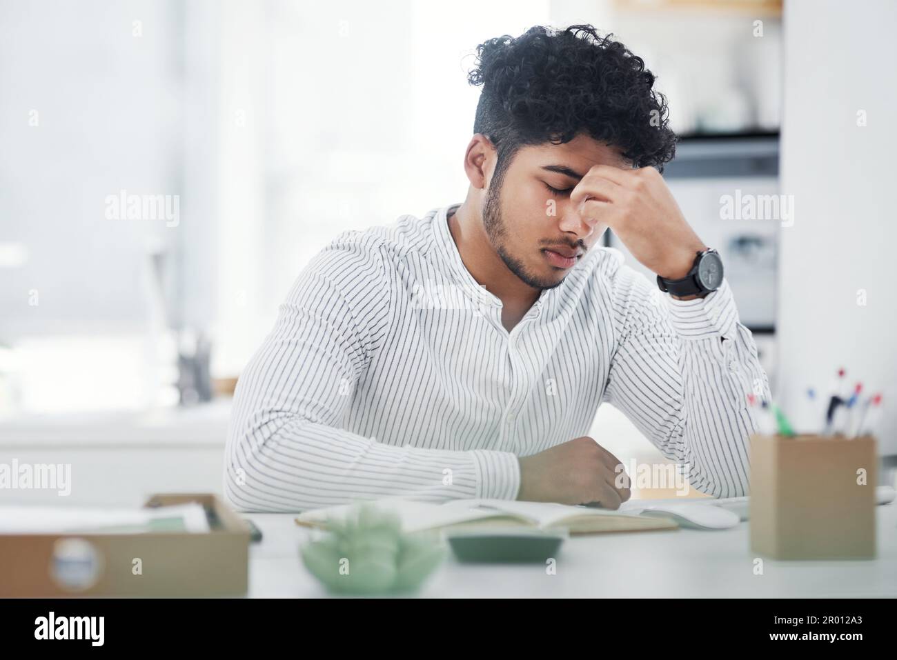 Okay now, calm down, dont panic. a young businessman looking stressed ...
