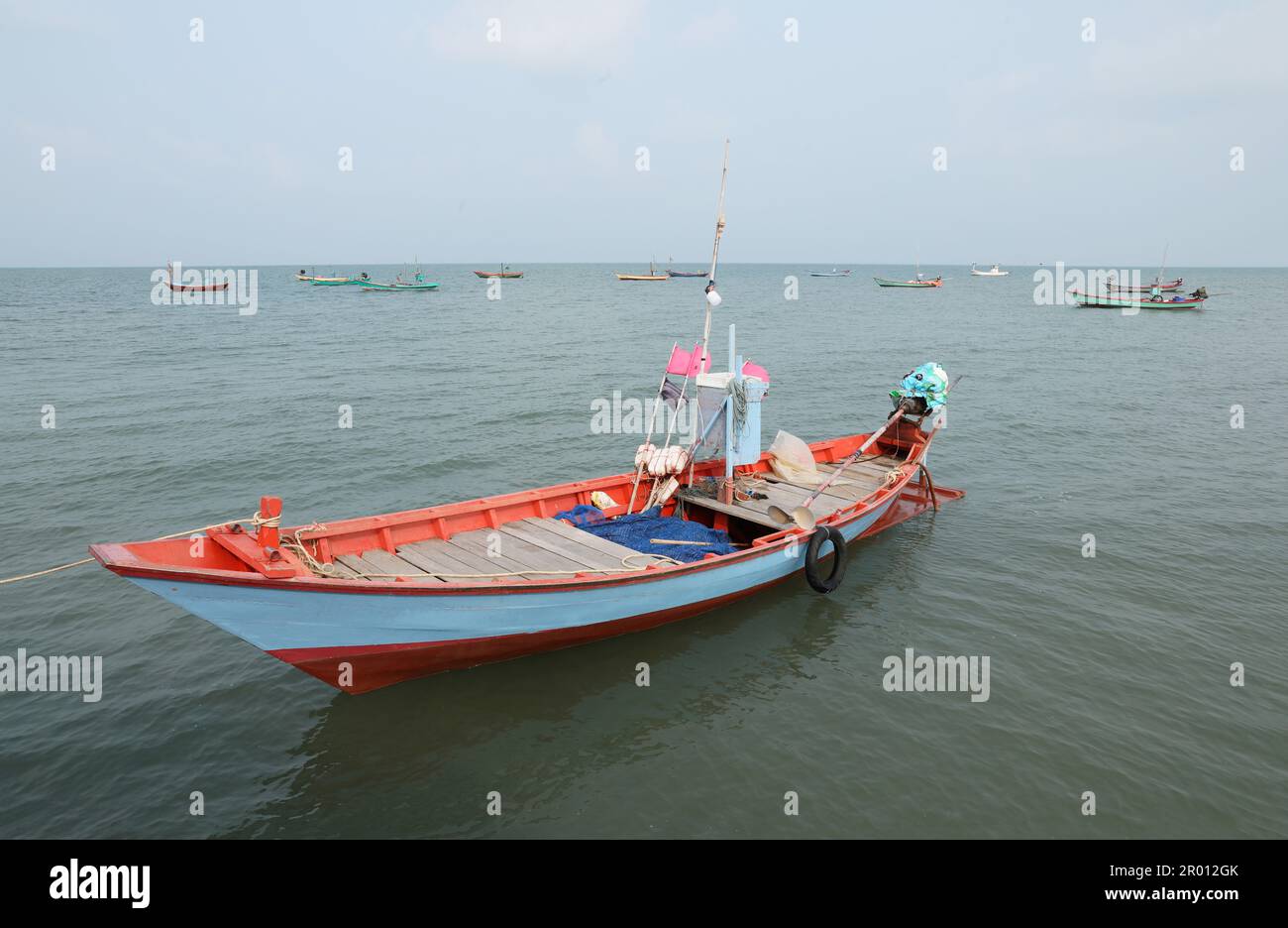 Colorful fishing boat floating on the sea. Stock Photo