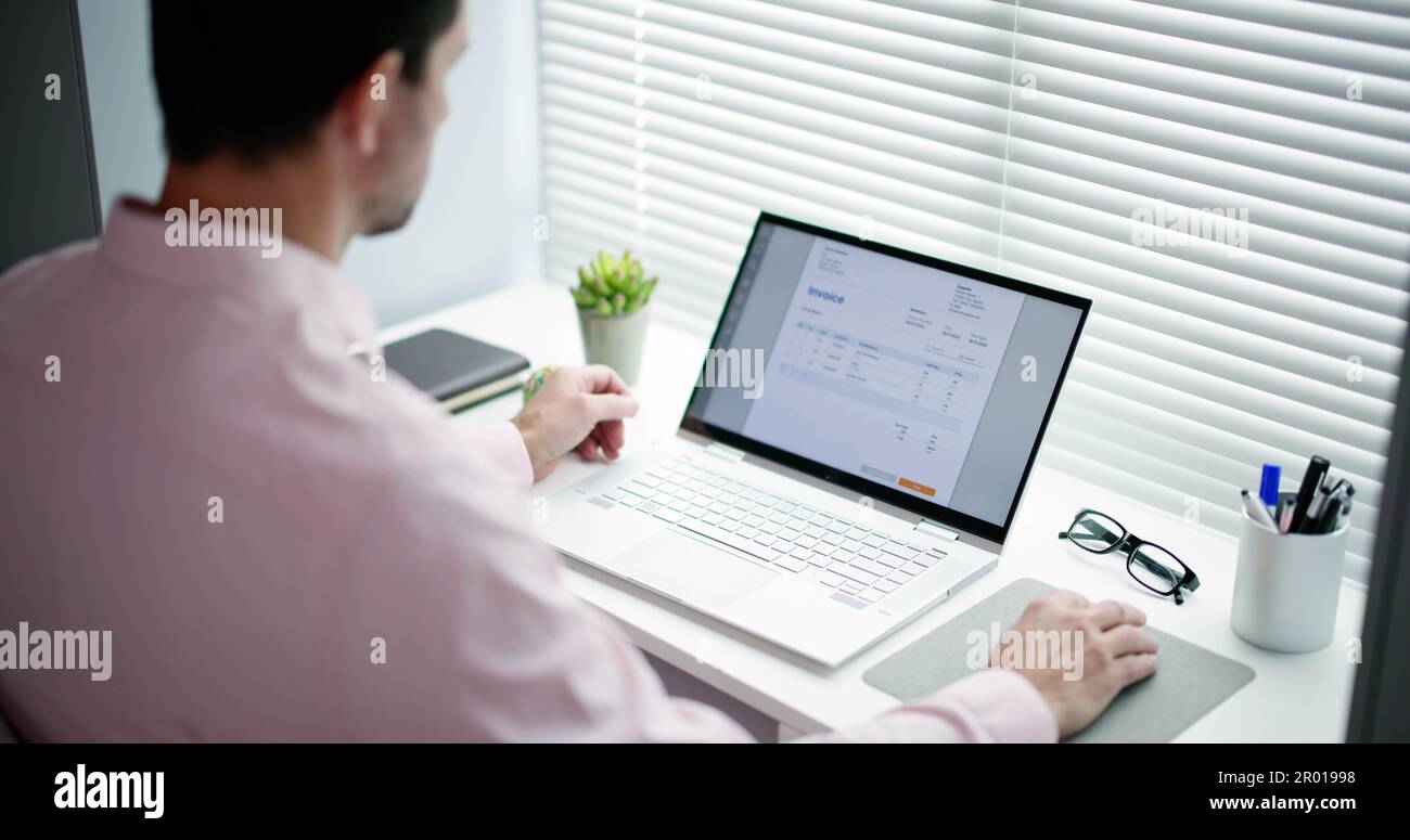 E Invoice Business Management. Accountant Using Electronic Invoice Stock Photo