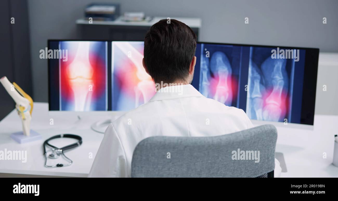 Dentist Using Computer Technology Dental Software For Teeth Xray Stock