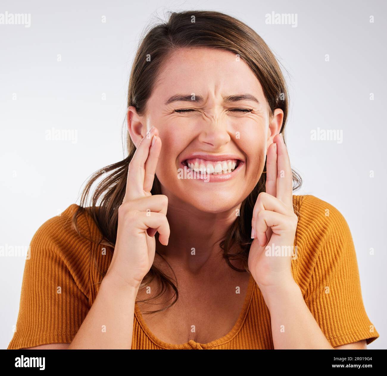 Woman crossing fingers luck against hi-res stock photography and images ...