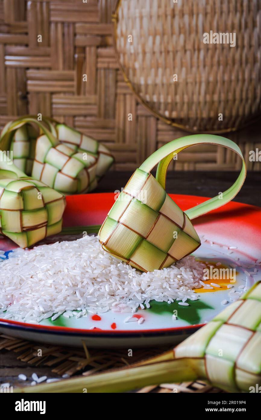 Ketupat is traditional food popular in Indonesia and Malaysia during of the celebration Islamic Eid Mubarak Stock Photo