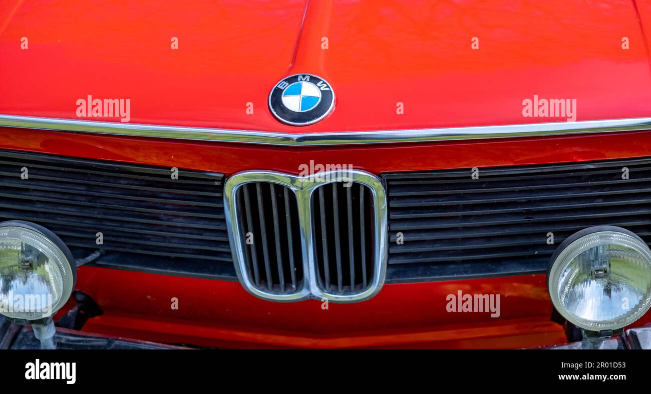 Earsham, Norfolk, UK – April 30 2023. Close up of the grille, headlights and bonnet badge of a fully restored classic series 3 BMW saloon car painted Stock Photo