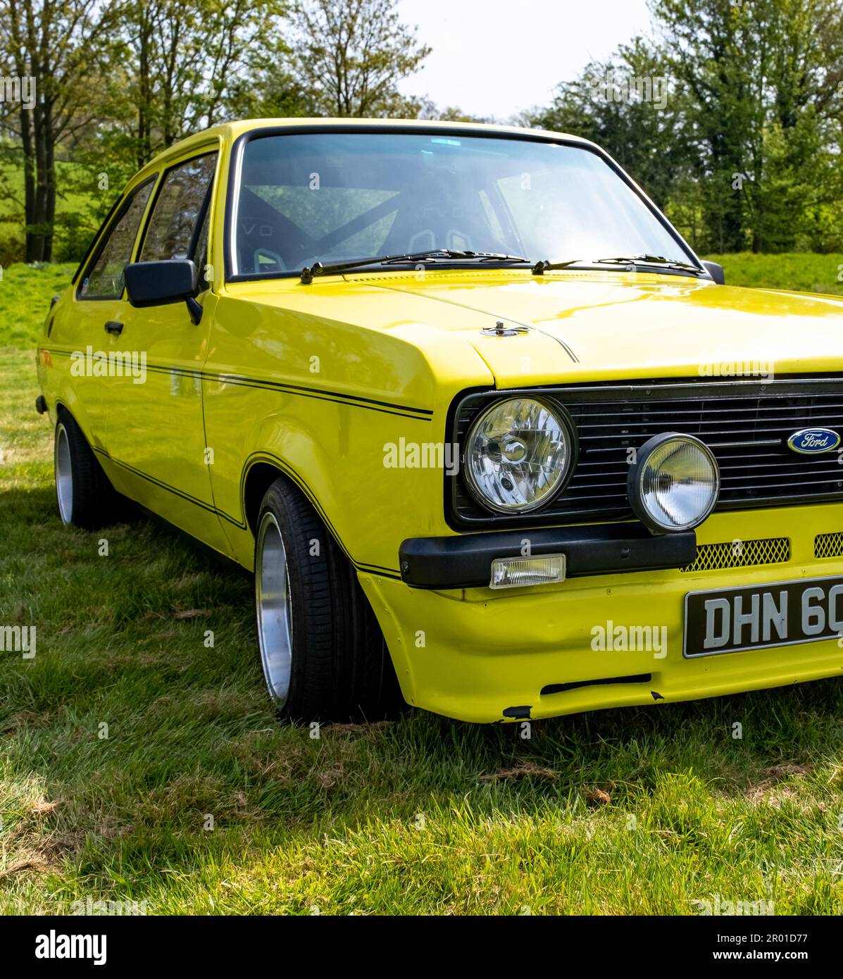 Earsham, Norfolk, UK – April 30 2023.  Close up of the front end, including the headlights and grille, of a fully restored Mk1 Ford Escort Mexico rall Stock Photo