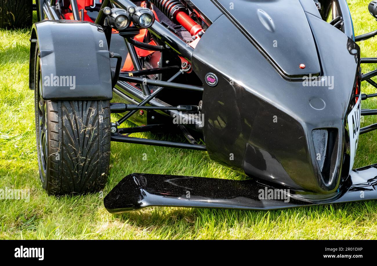 Earsham, Norfolk, UK – April 30 2023. The front end and nose cone of a custom built kit car on display at a small and local outdoor car show Stock Photo