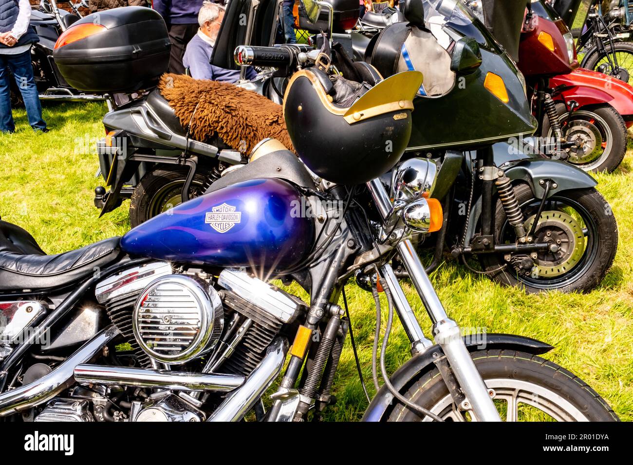 Earsham, Norfolk, UK – April 30 2023. Custom built Harley Davidson motorcycle on display at a small and local outdoor auto show Stock Photo
