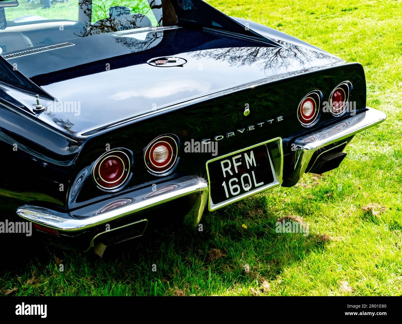 Earsham, Norfolk, UK – April 30 2023. The rear end and back of a classic American Corvette muscle car on display at a small and local outdoor car show Stock Photo