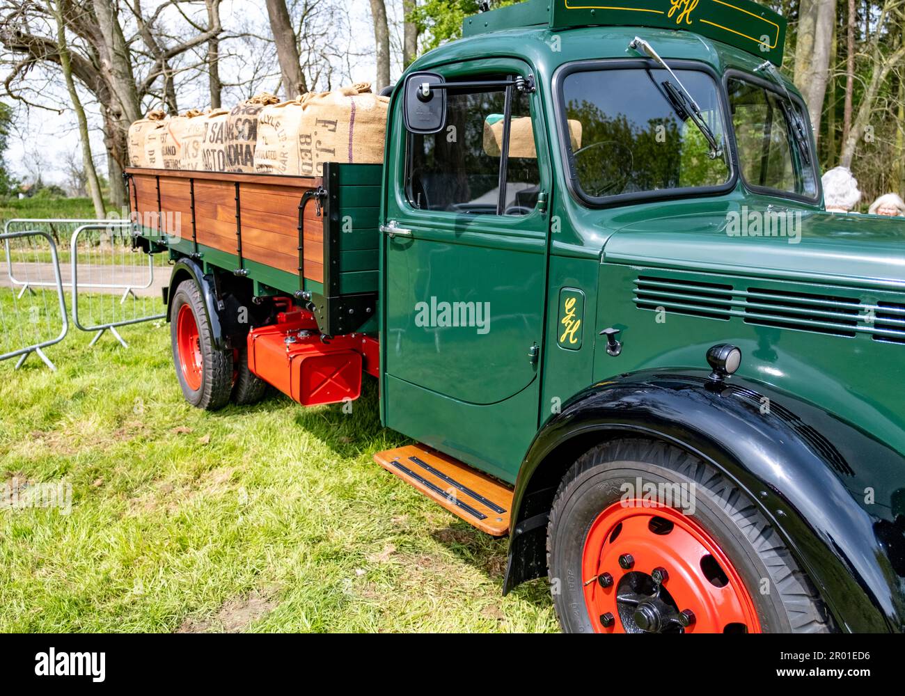 Earsham, Norfolk, UK – April 30 2023. A restored classic delivery truck loaded up with sacks of product on display at a small and local outdoor car sh Stock Photo