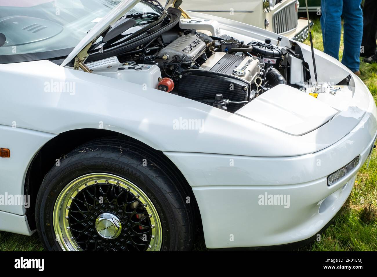 Earsham, Norfolk, UK – April 30 2023. Close up of the bonnet and engine of a classic Lotus Elan SE sports car on display at a small and local car show Stock Photo