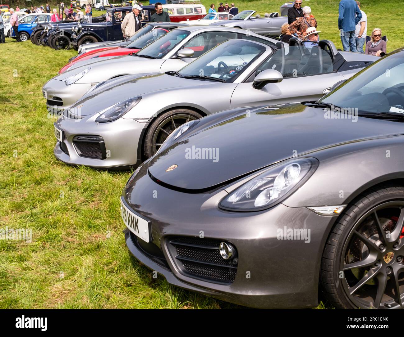 Earsham, Norfolk, UK – April 30 2023. A row of Porsche sports cars lined up on display a small and local outdoor car show Stock Photo