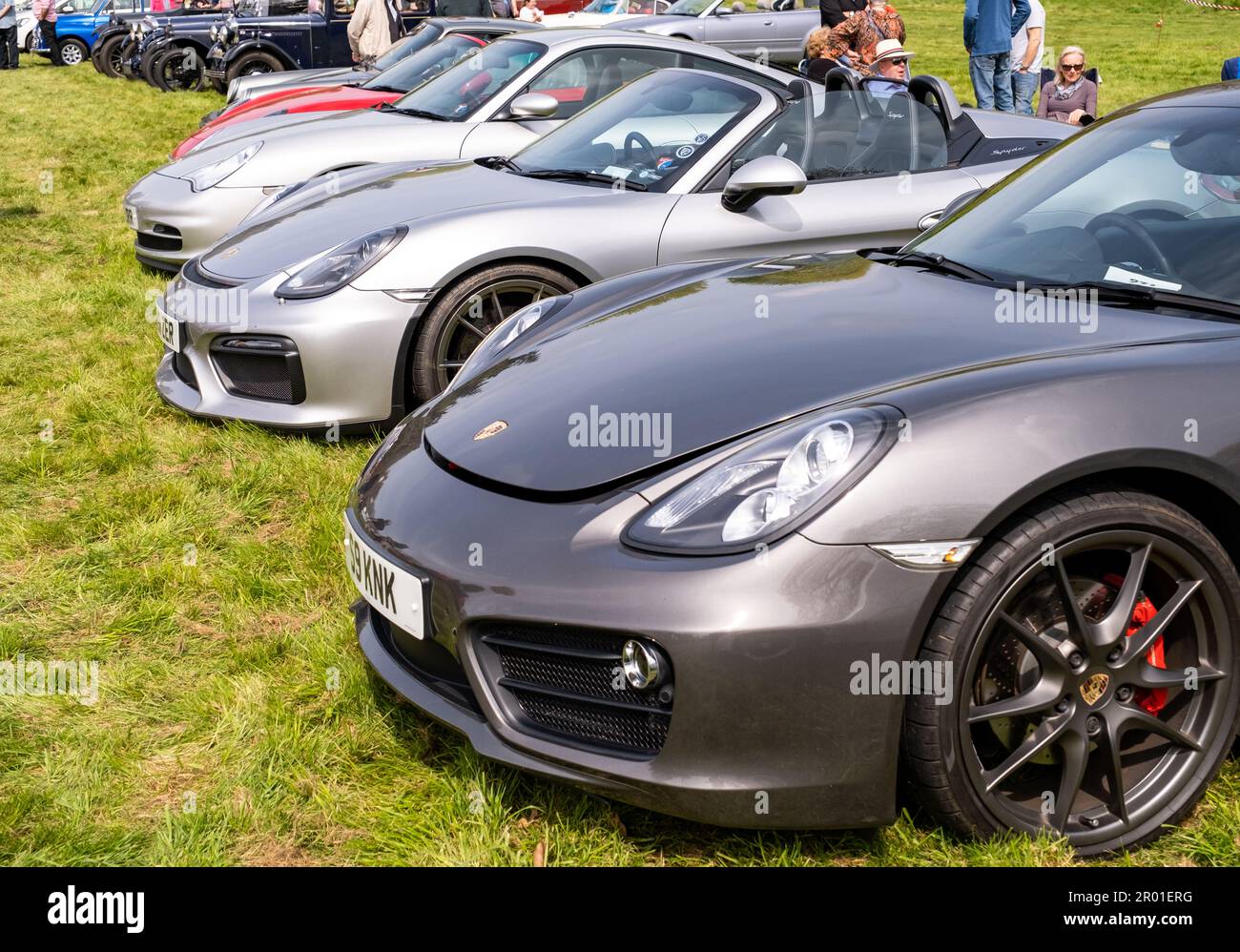 Earsham, Norfolk, UK – April 30 2023. A row of Porsche sports cars lined up on display a a small and local outdoor car show Stock Photo