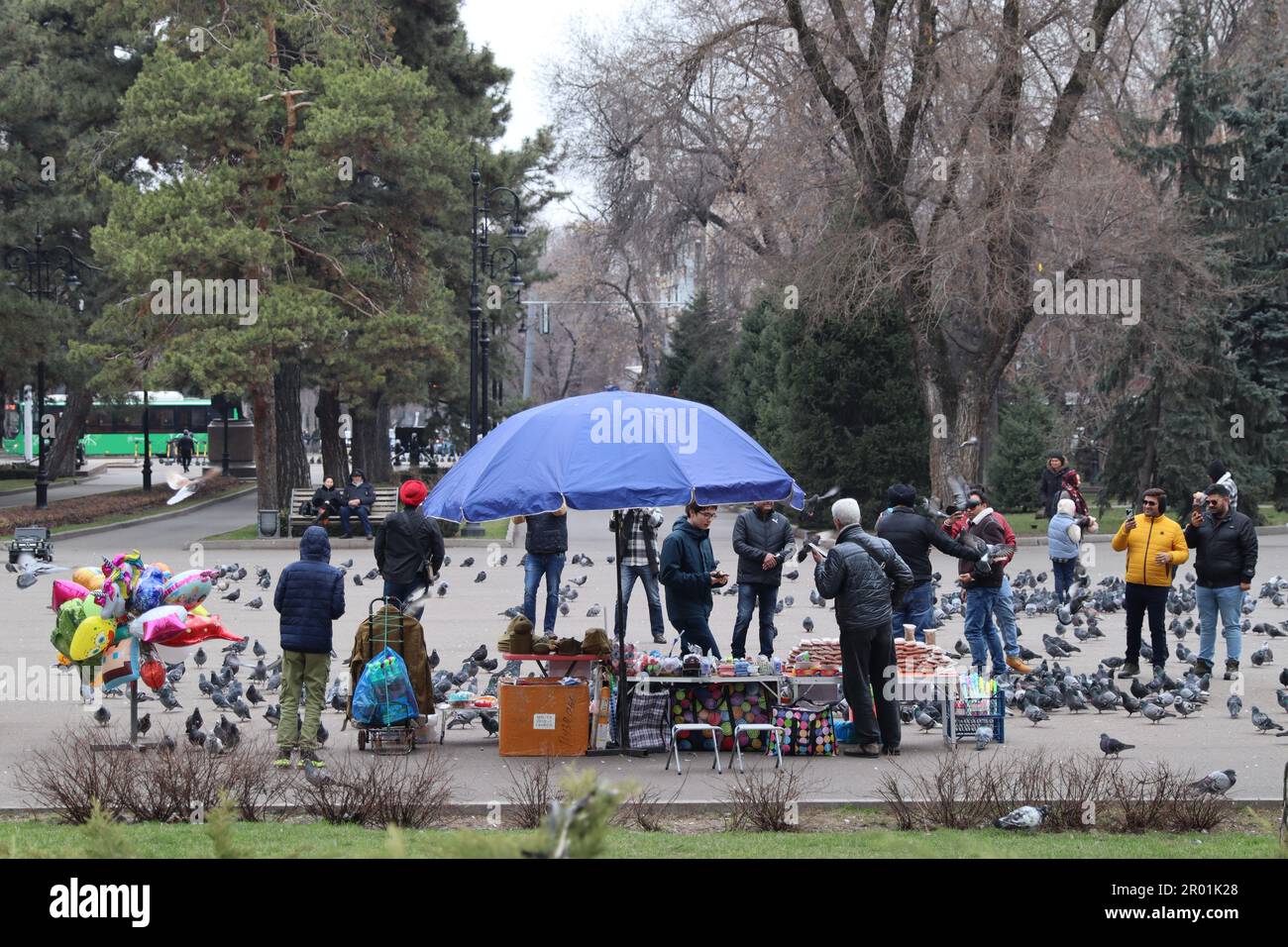 PRODUCTION - 18 March 2023, Kazakhstan, Almaty: People in a park in the