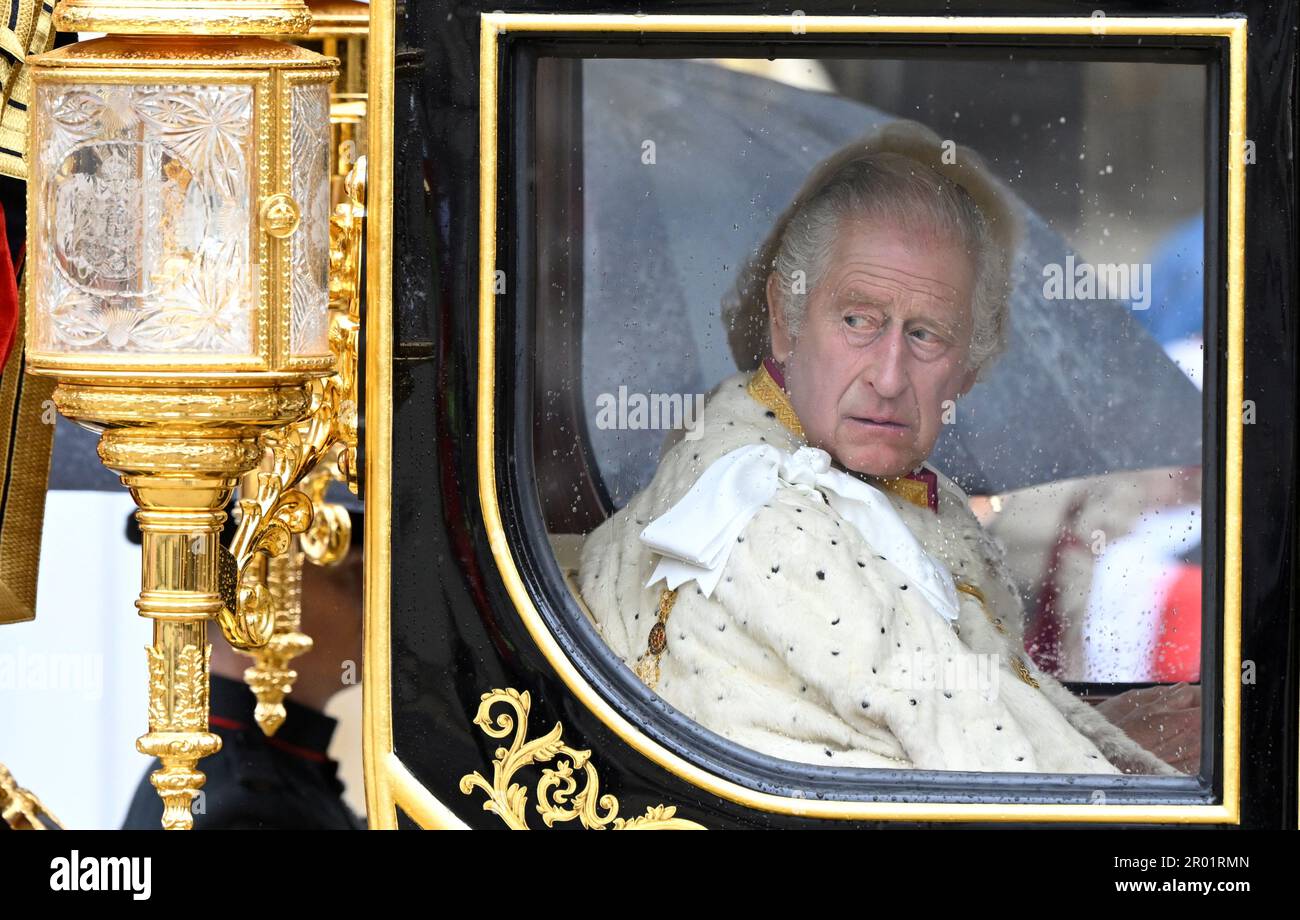 King Charles III and Queen Camilla are carried in the Diamond Jubilee State Coach as the King's Procession arrives at Westminster Abbey for their coronation ceremony in London. Picture date: Saturday May 6, 2023. Stock Photo