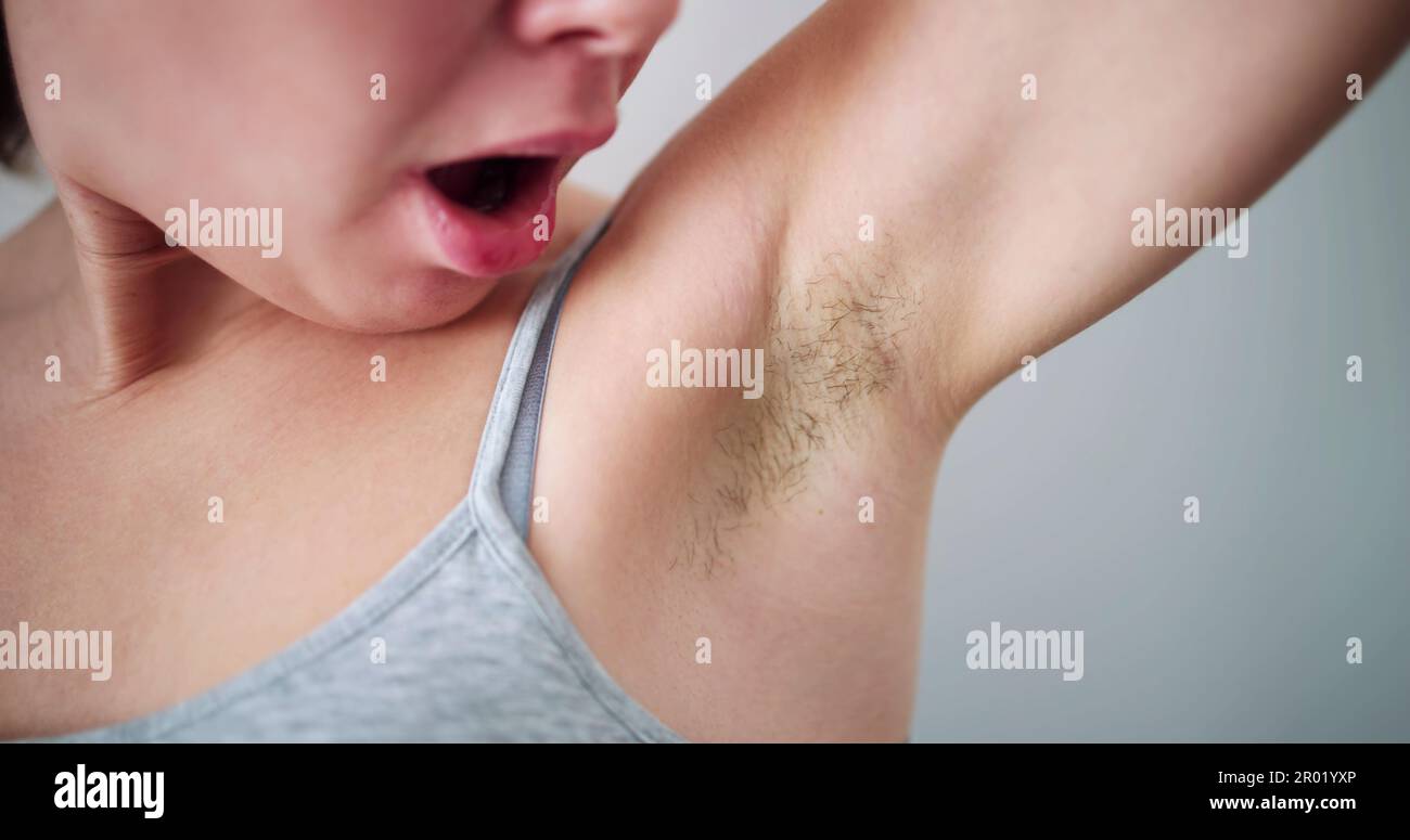 Young Woman With Hairy Armpit. Hair Removal And Shaving Stock Photo