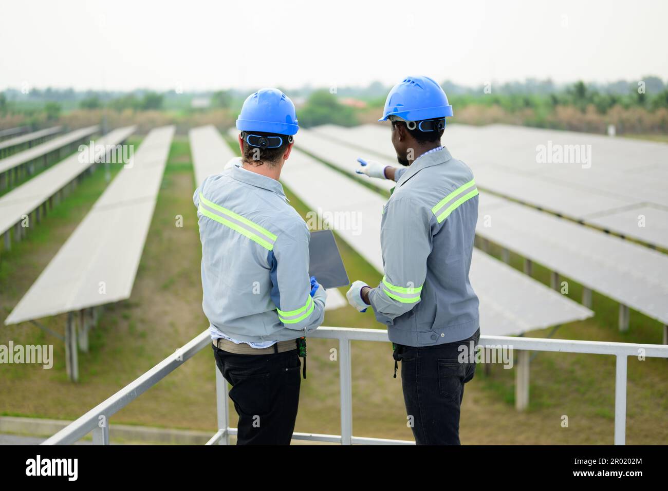 Solar energy engineer maintaining panels hi-res stock photography and ...
