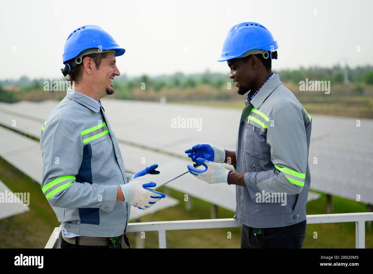 Solar energy engineer maintaining panels hi-res stock photography and ...