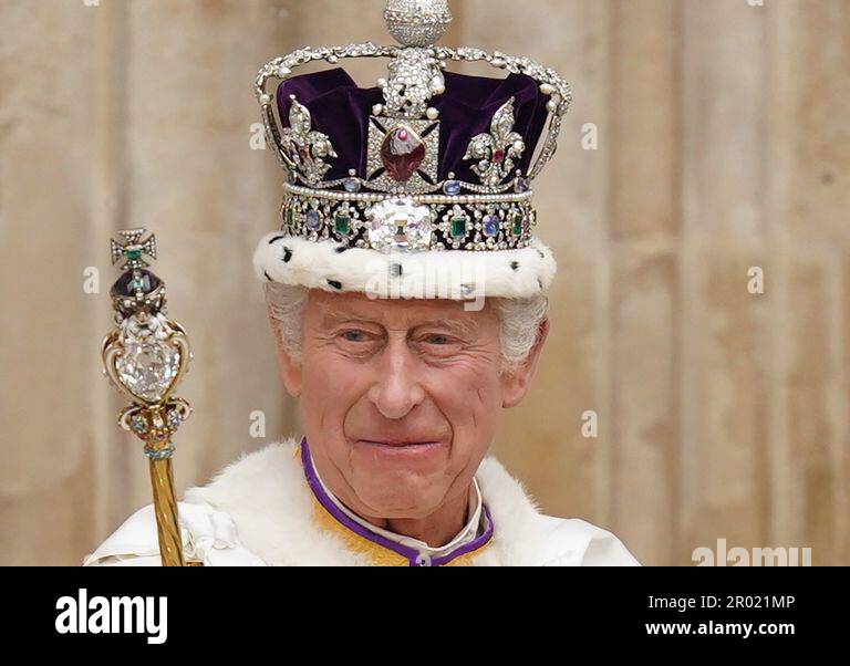 King Charles III, wearing the Imperial State Crown, leaves Westminster