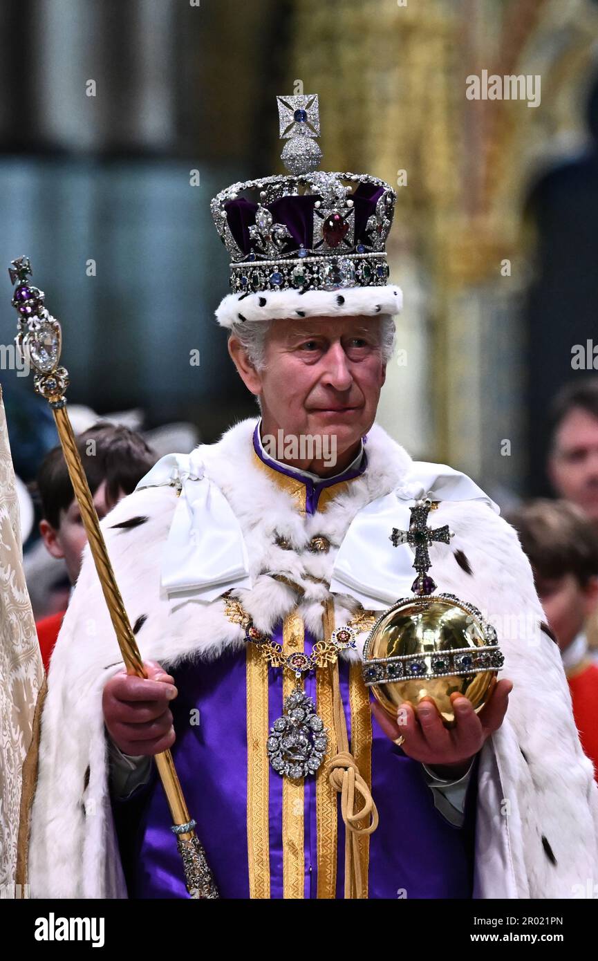 King Charles III wearing the Imperial state Crown carrying the