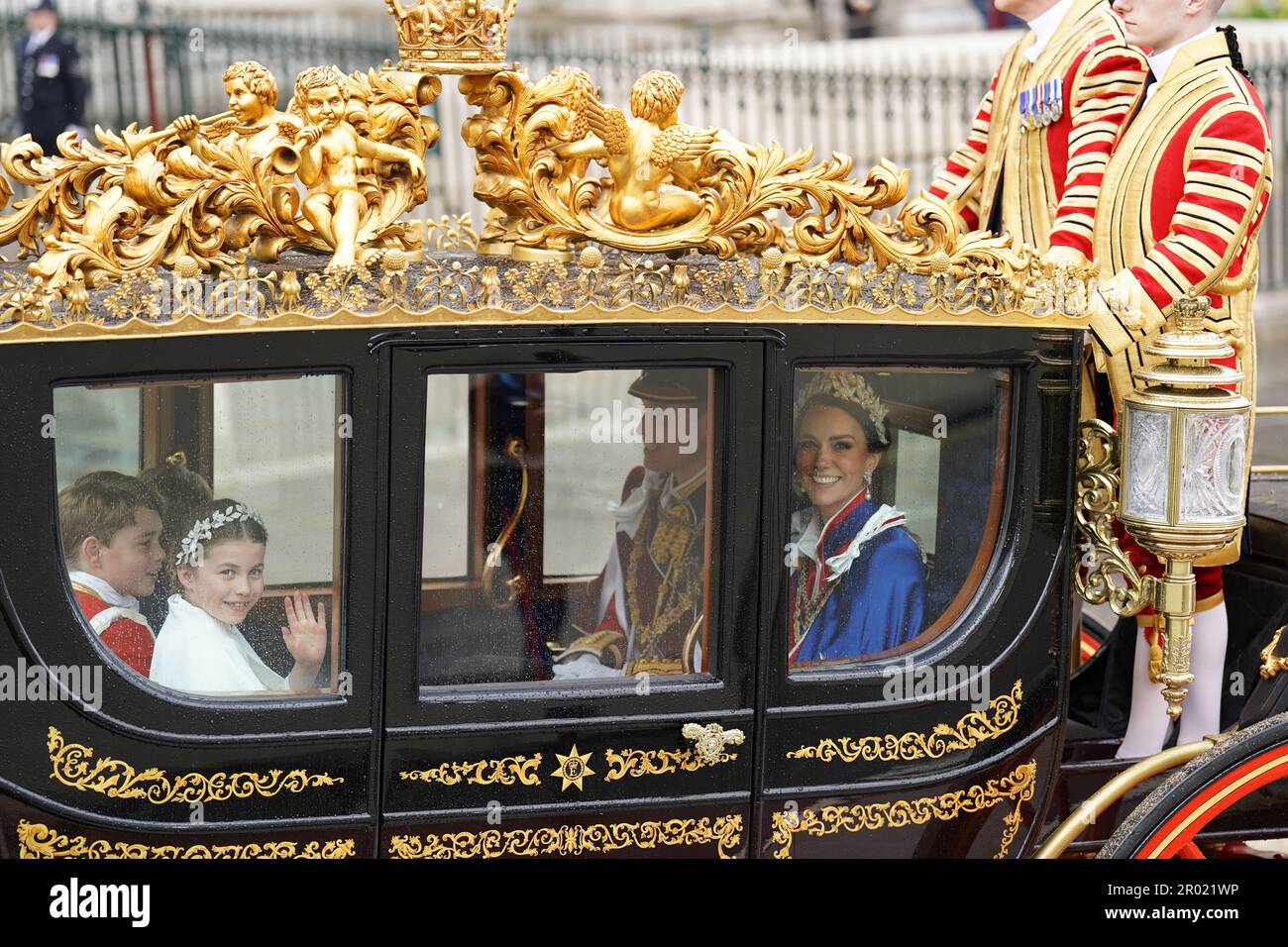 (left to right) Prince George, Princess Charlotte and the Prince and Princess of Wales return to Buckingham Palace by coach following the coronation ceremony of King Charles III and Queen Camilla in central London. Picture date: Saturday May 6, 2023. Stock Photo
