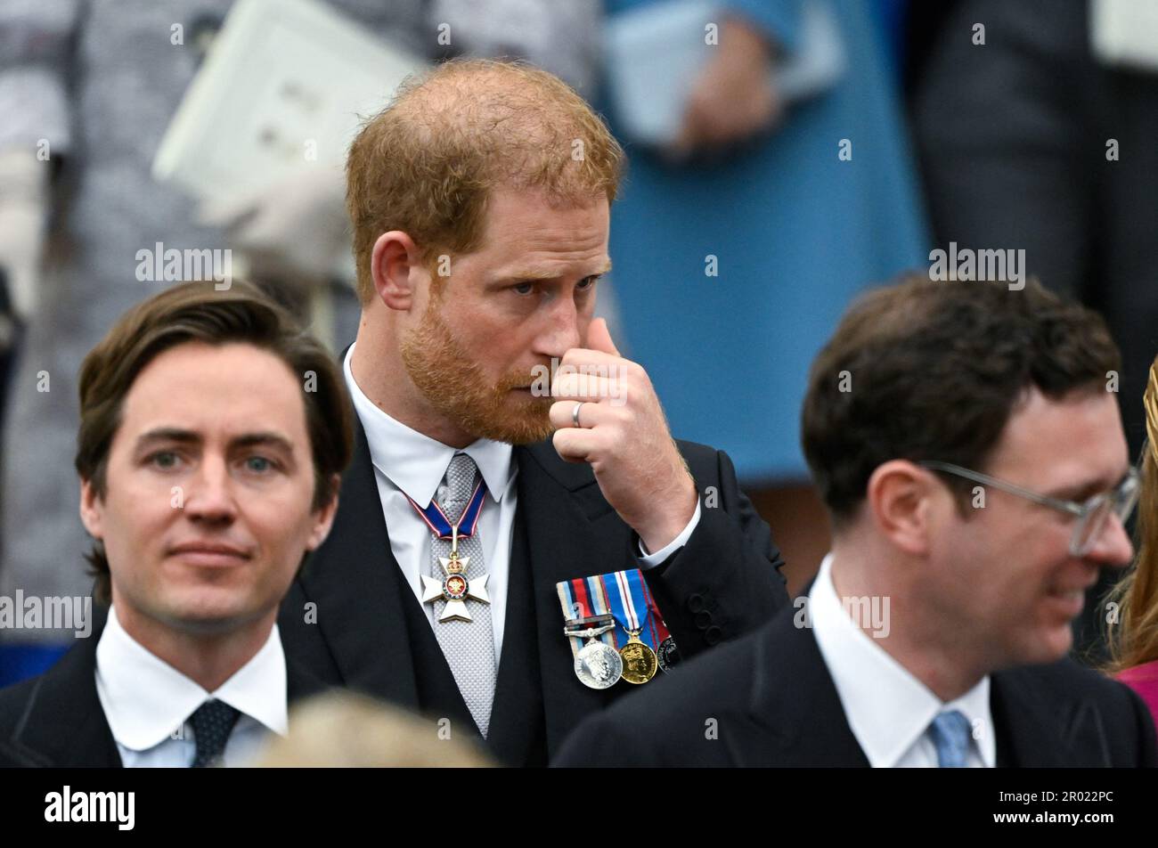 (Left to right) Edoardo Mapelli Mozzi, the Duke of Sussex and Jack Brooksbank depart Westminster Abbey, London, following the Coronation of King Charles III and Queen Camilla. Picture date: Saturday May 6, 2023. Stock Photo