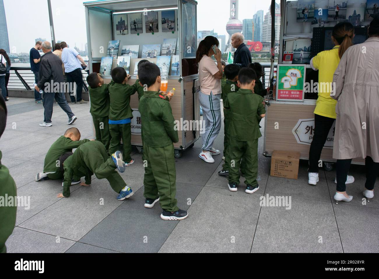 Shanghai, China, Street Scene, Chinese Tourists, CHildren in Military Uniforms, Visiting Bund, in CIty Center Stock Photo