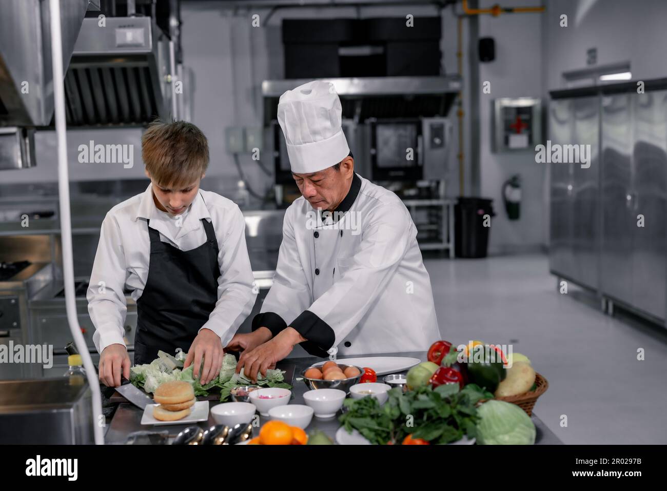 Teenagers learn from expert chefs at culinary school to prepare