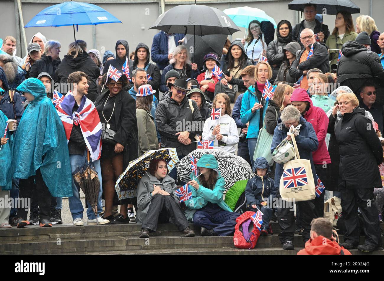 Trafalgar square, May 6, 2023, London, UK. Thousands of Royal fans dressed and brandished the Union Jack flag at the coronation of King Charles III in London, United Kingdom. Credit: See Li/Picture Capital/Alamy Live News Stock Photo