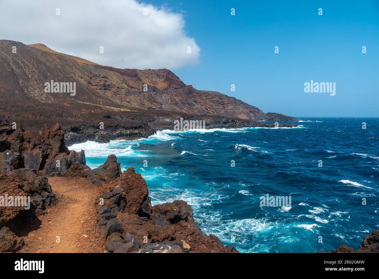 Cliffs from the volcanic trail in the village of Tamaduste on the coast of the island of El Hierro, Canary Islands, Spain. vertical photo Stock Photo