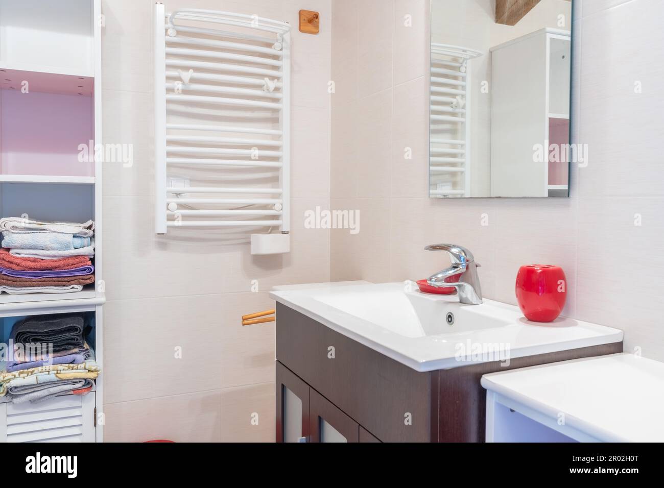 Home bathroom, bright new bathroom interior with tiled glass shower, vanity cabinet, interior designed, towel storage cabinet Stock Photo